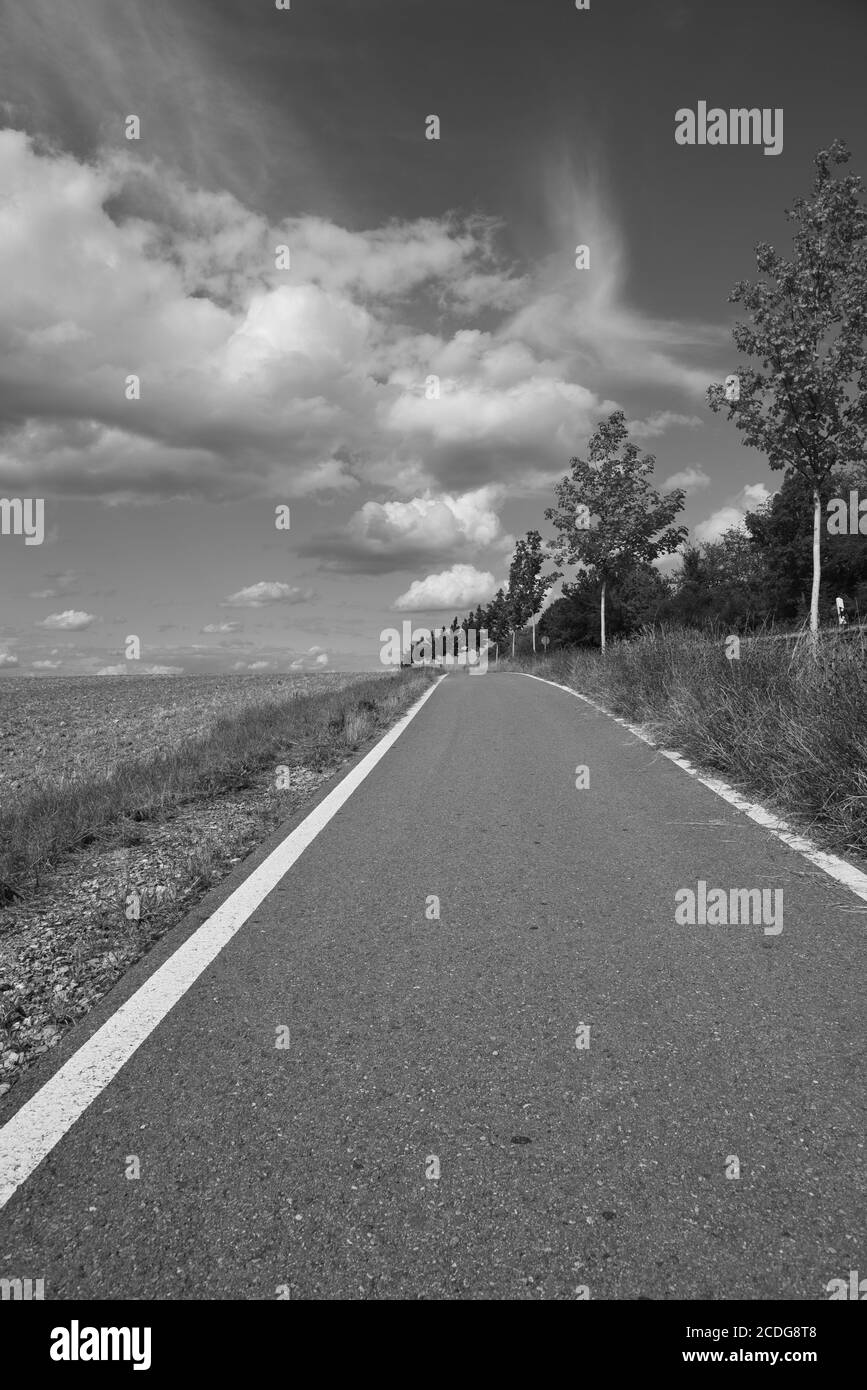 Black and white landscape with road and clouds hi-res stock photography ...