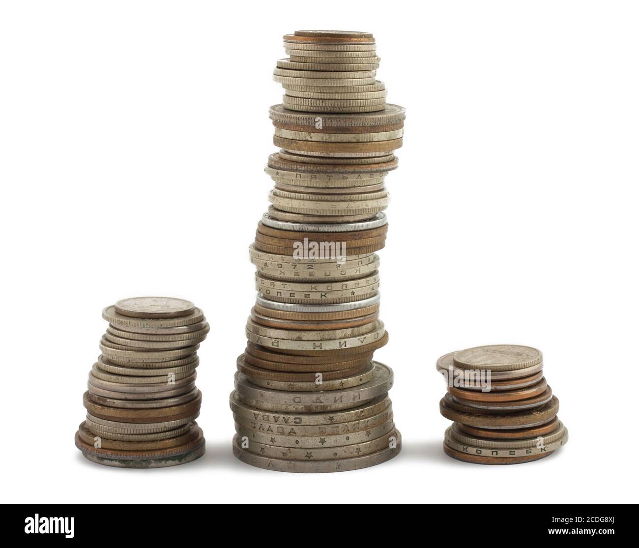Three columns of coins on white Stock Photo