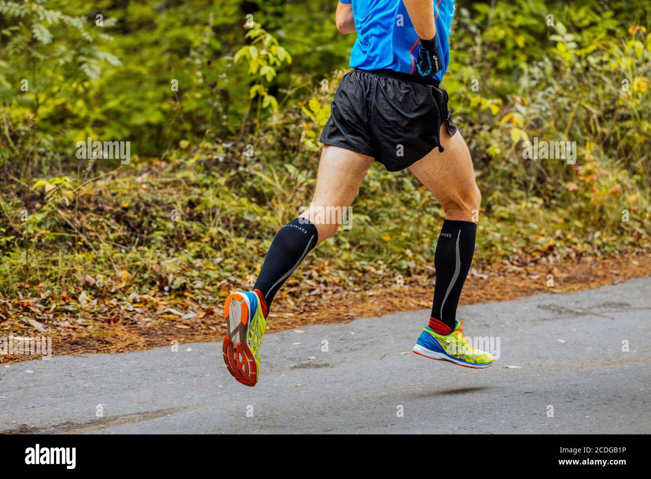 Chelyabinsk, Russia - September 11, 2016: legs man athlete runner in  running shoes Asics Gel DS Racer 10 in City marathon Stock Photo - Alamy