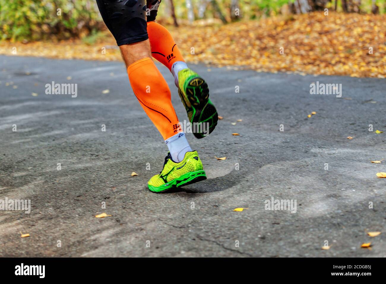 Chelyabinsk, Russia - September 11, 2016: legs runner in running shoes Mizuno and compression socks Cep in City marathon Stock Photo