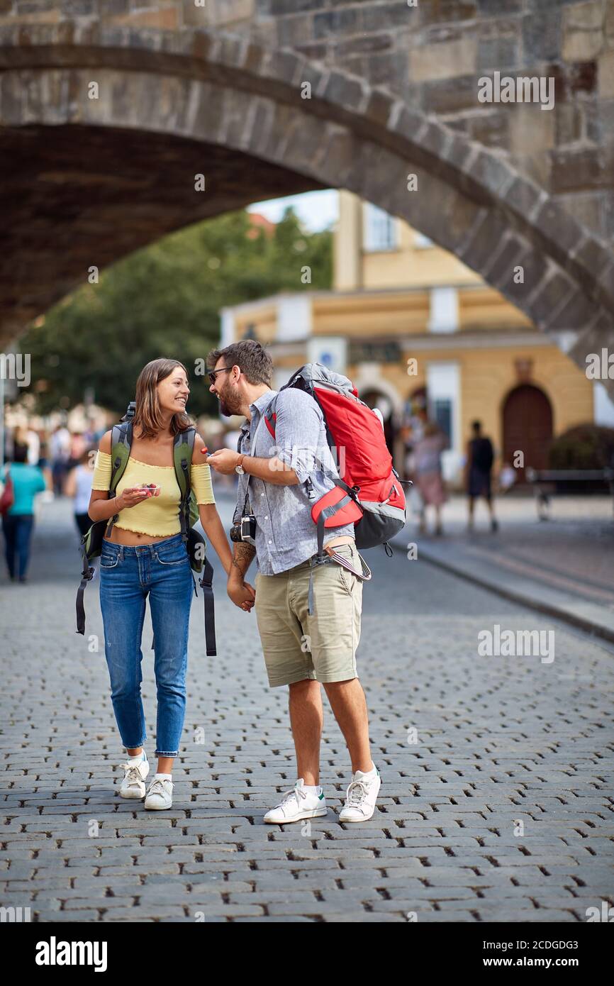 Young couple in love walking in the streets of Prague. Travel, tourism and people concept. Stock Photo