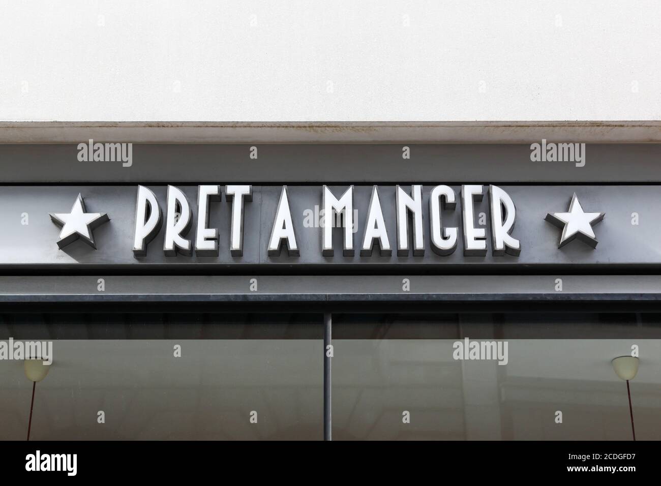 London, United Kingdom - September 25, 2019: Pret a manger logo on a wall. Pret a Manger is an international sandwich shop chain based in the UK Stock Photo