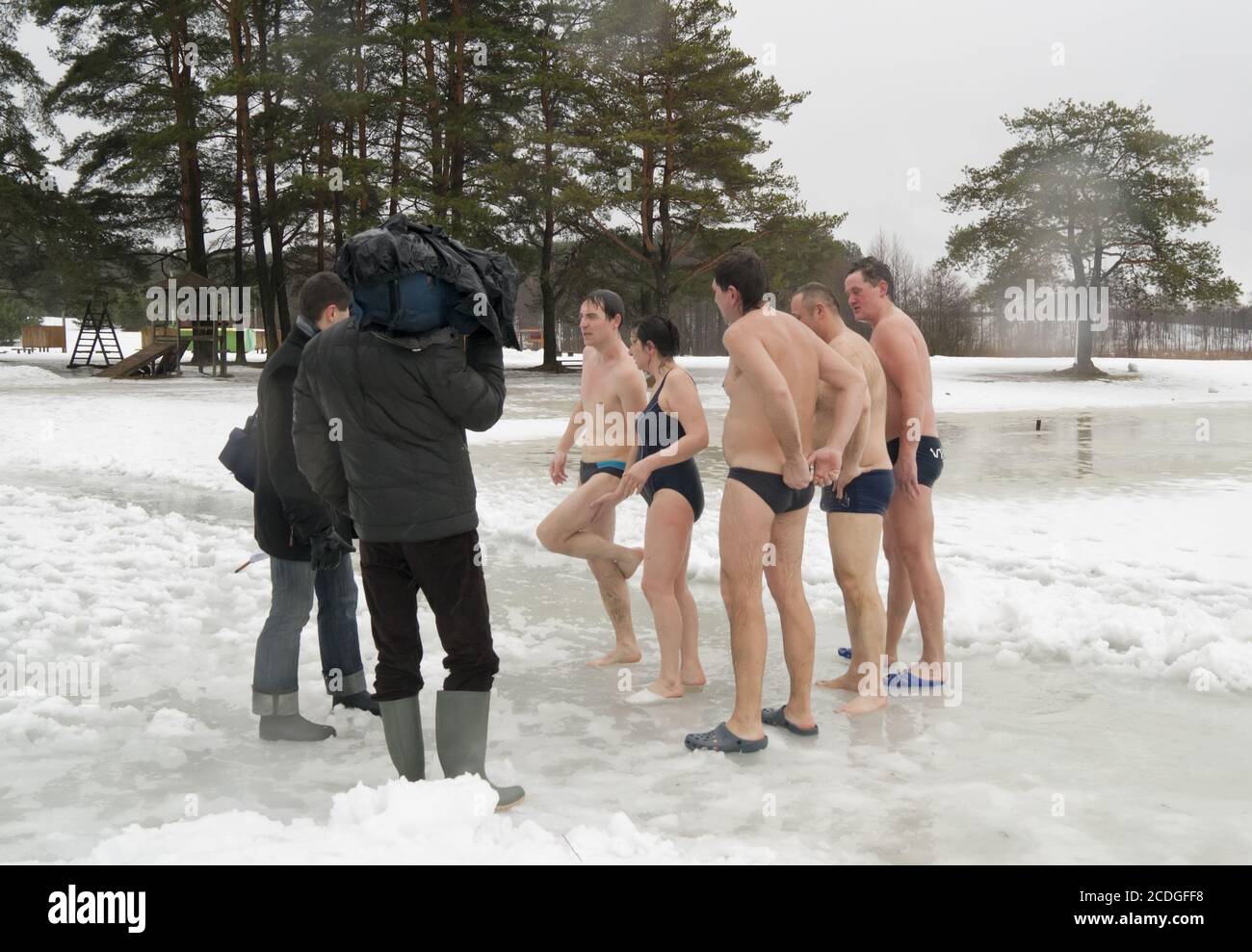VILNIUS, LITHUANIA – FEBRUARY 5: Fans of winter swimming take a bath in some ice water on February 5, 2011 in Vilnius, Lithuan Stock Photo
