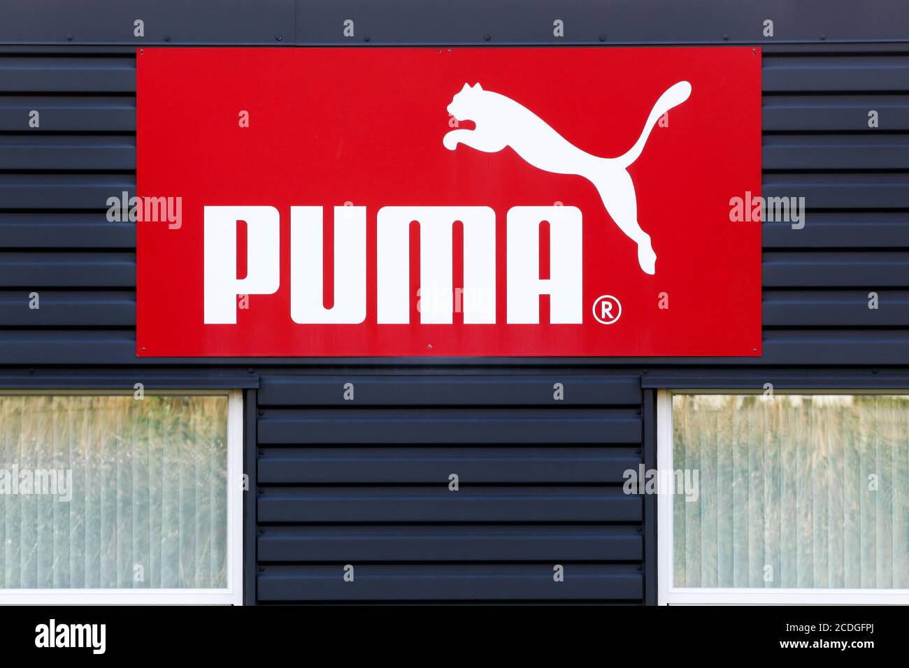 Skanderborg, Denmark - July 16, 2019: Puma logo on a facade. Puma is a major german multinational company that produces athletic and casual footwear Stock Photo