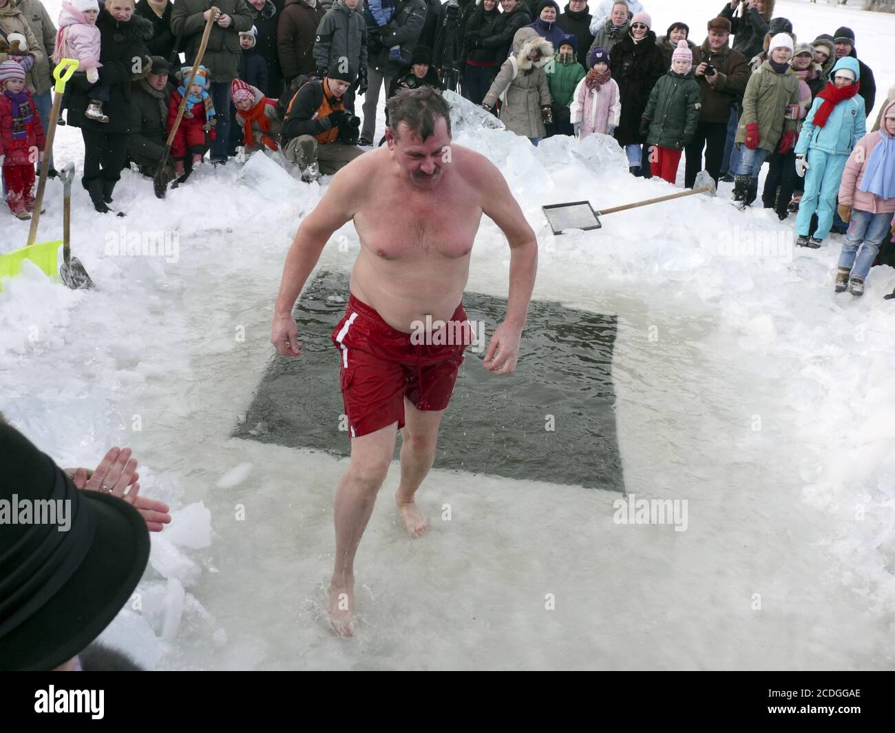 VILNIUS, LITHUANIA – FEBRUARY 5: Fans of winter swimming take a bath in some ice water on February 5, 2011 in Vilnius, Lithuan Stock Photo