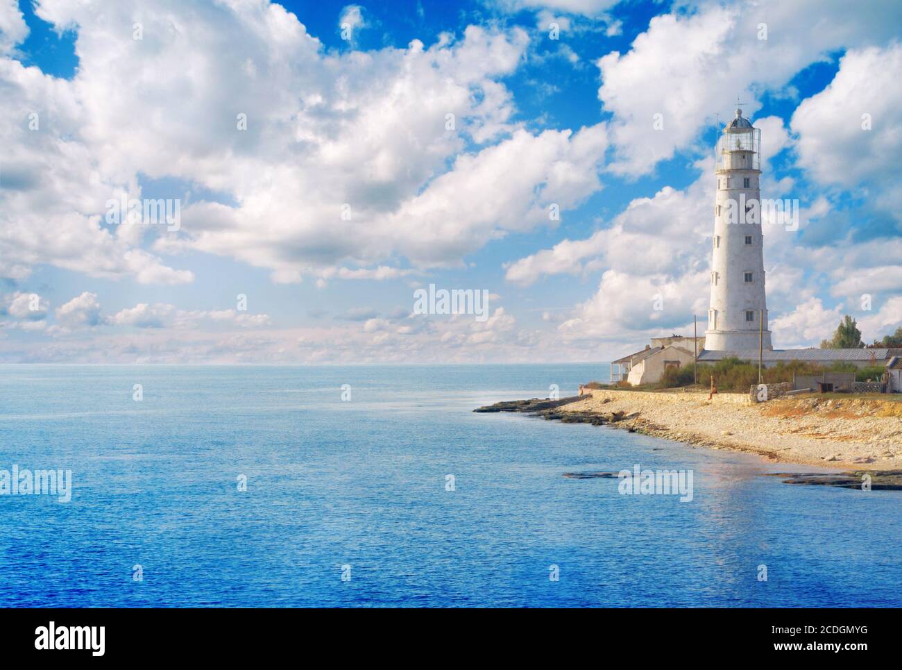 Old lighthouse on sea coast Stock Photo