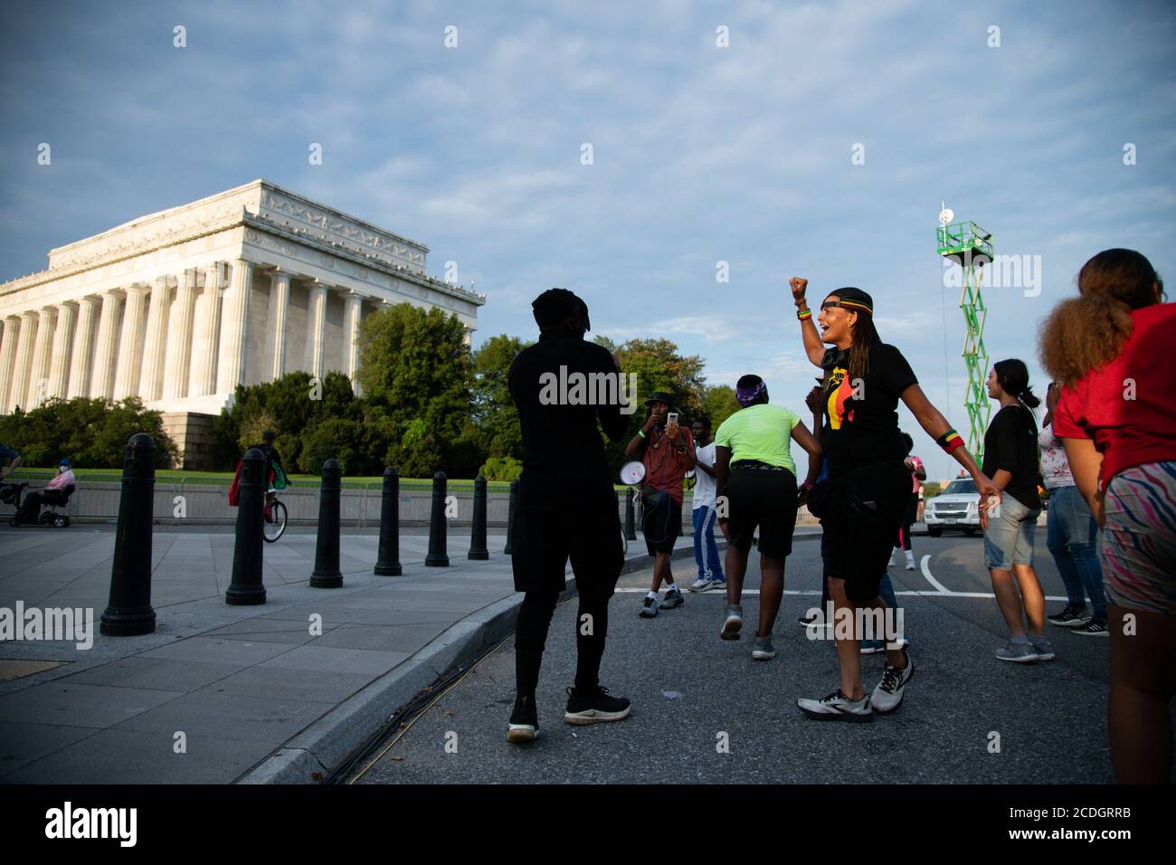 A protest march organized by activist Frank Nitty that started in Milwaukee arrives in at the Lincoln Memorial after more than 700 miles of walking before the beginning of civil rights march organized by Al Sharpton to call attention to systemic racism and police violence after the May police killing of George Floyd in Minnesota, in Washington, DC, on August 28, 2020, amid the coronavirus pandemic. The night before The Commitment March: Get Your Knee Off Our Necks, protests consumed the blocks surrounding the White House, as President Trump gave his presidential nomination acceptance speech Stock Photo