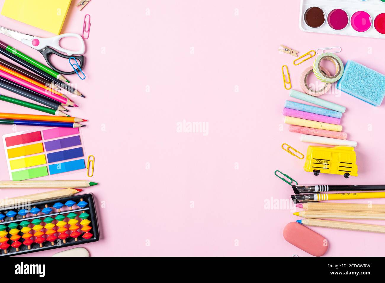 Flat lay of modern pink office desktop with school supplies on table ...