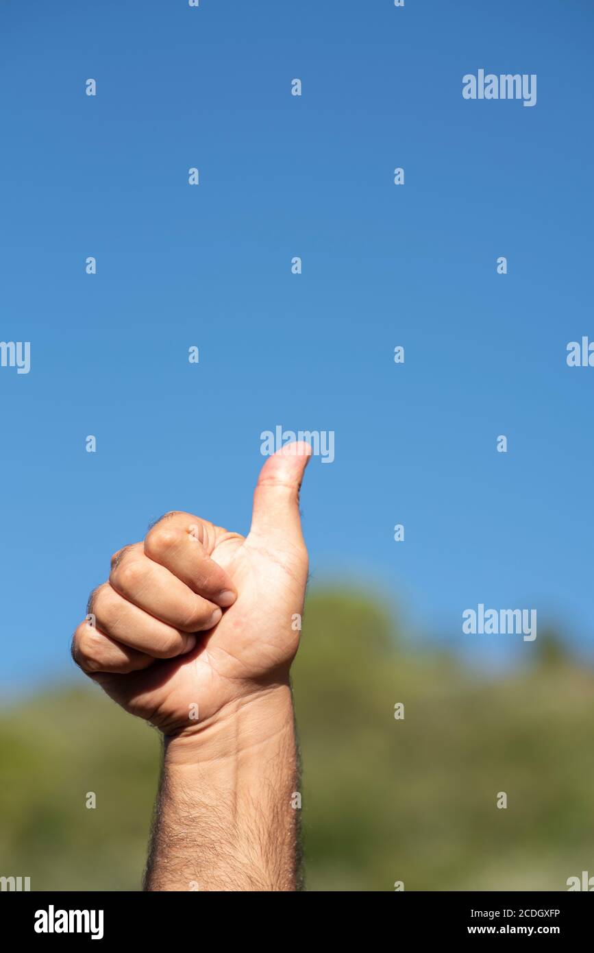Man showing thumbs up gesture Stock Photo