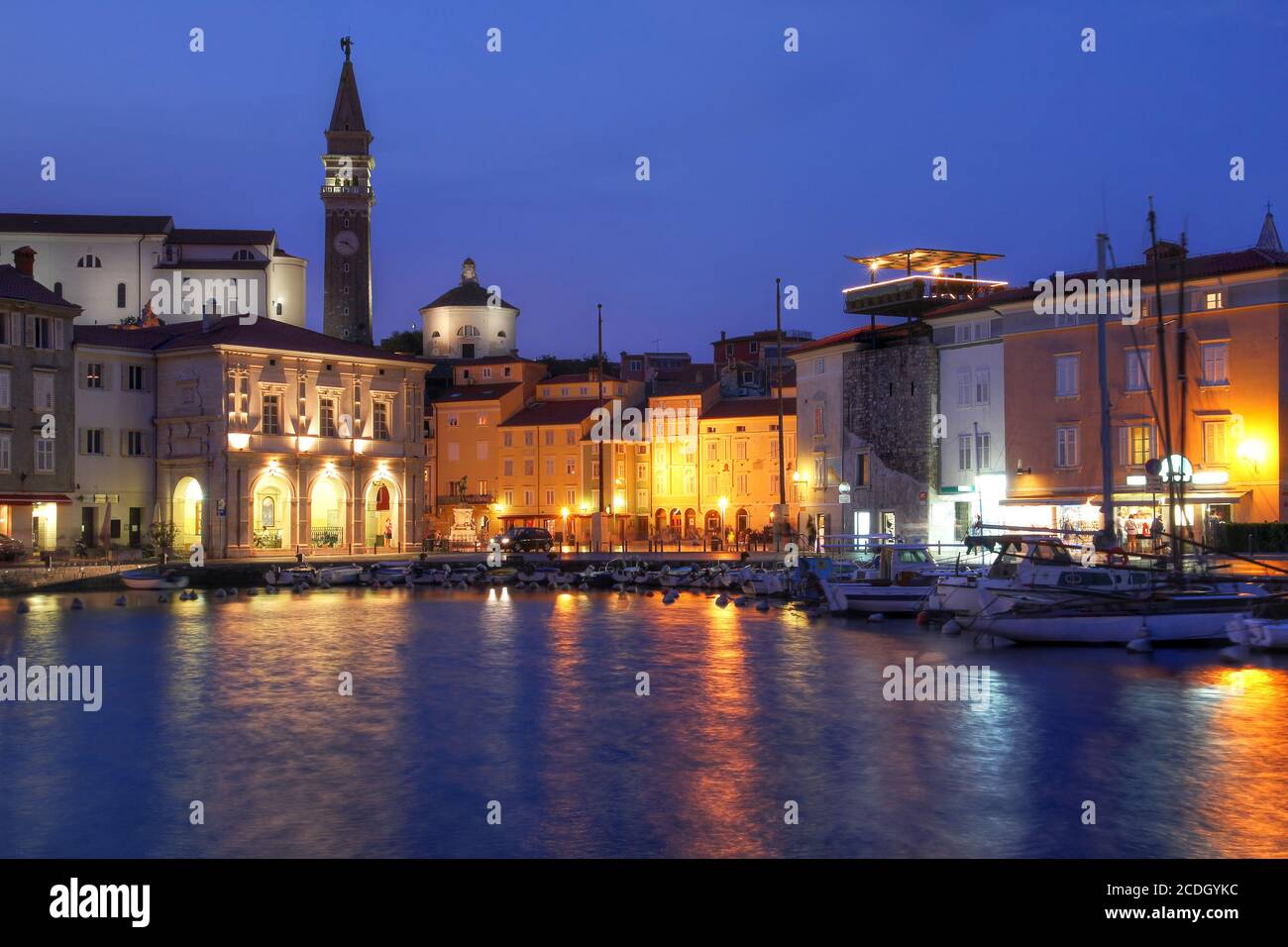 Evening scene of the small harbour in historical town of Piran, Slovenia. Stock Photo