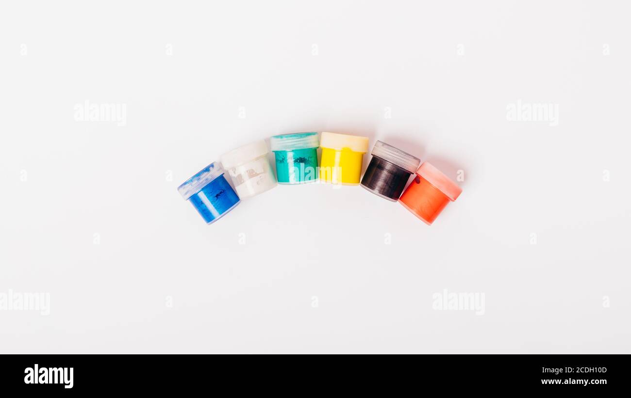 Group of multi-colored paints jars top view Stock Photo