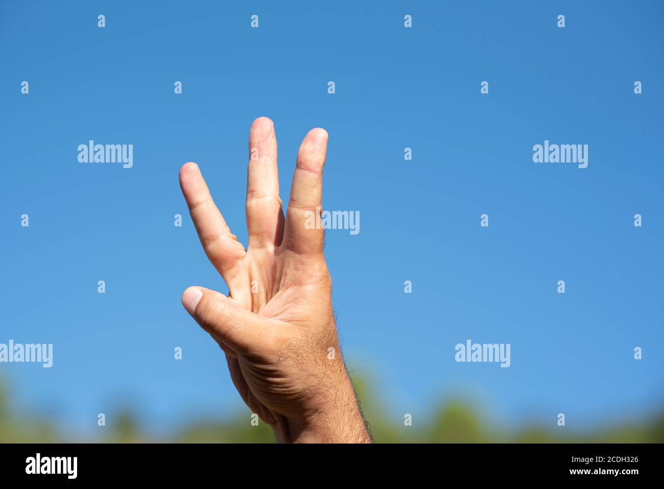 Man's hand counting three Stock Photo
