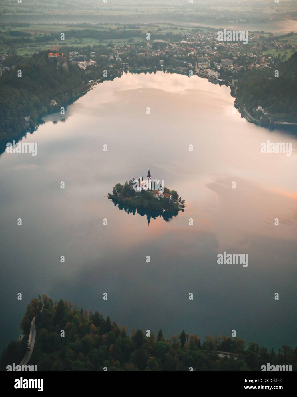 A Fairytale island with a church in the middle of lake. Stock Photo