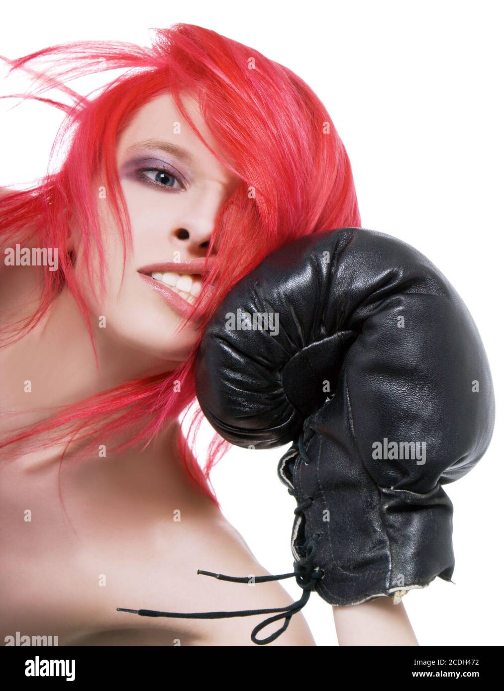 Redhair girl receives a knockout blow in the face of boxing gloves
