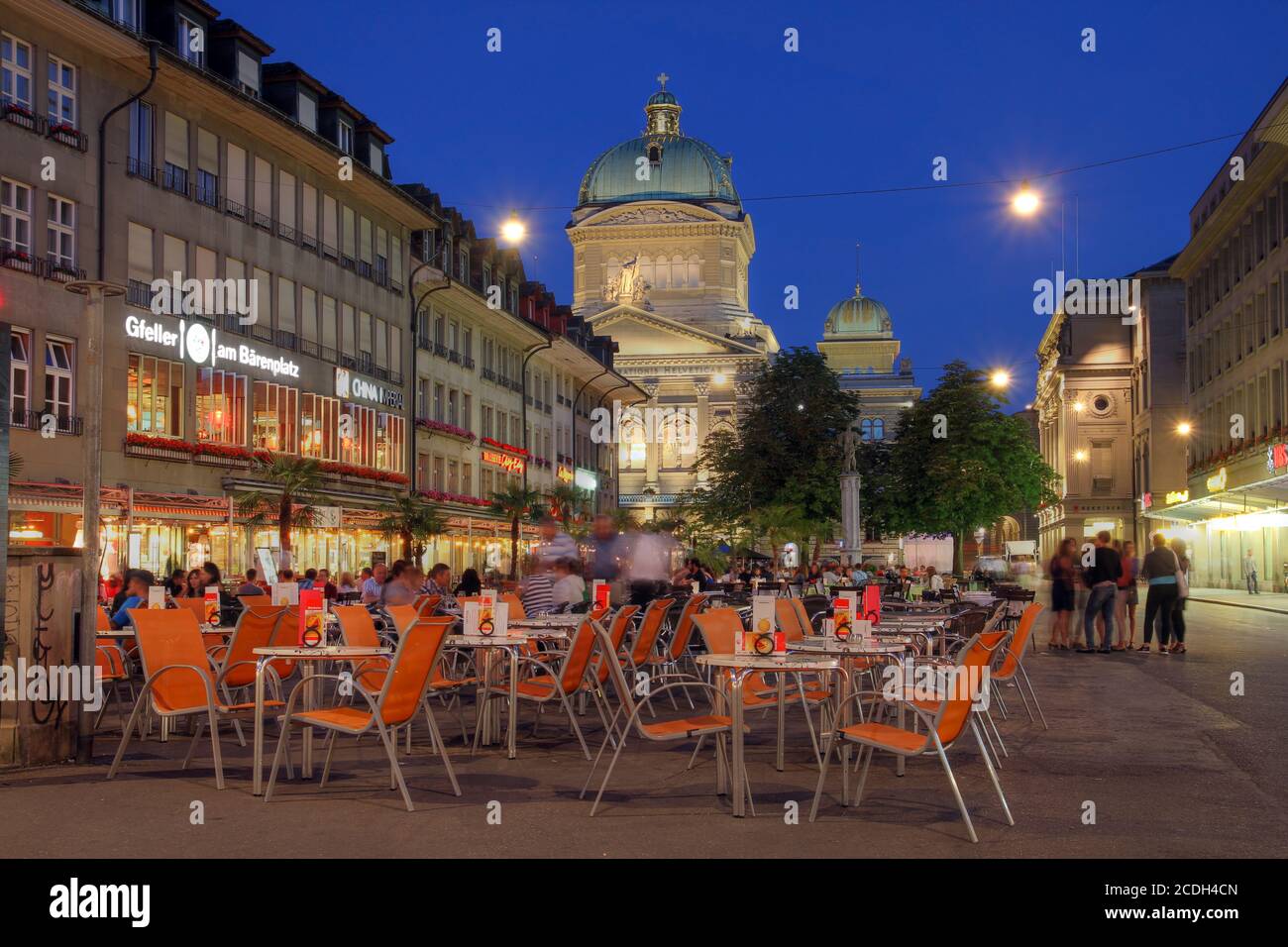 BERN, SWITZERLAND - JUNE 23: Barenplatz, with the Swiss Parliament Building looming over the square in Bern, Switzerland on June 23, 2012. Barenplatz Stock Photo
