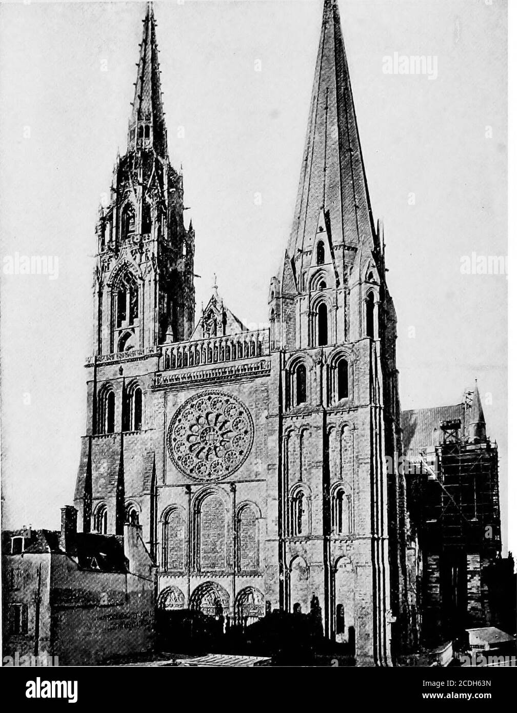 . A short history of art . THE CATHEDRAL OF AMIENSSame period as N6tre Dame, last years of twelfth and beginning of thir-teenth centuries. Typical cathedral of France. Having less charmthan one or two others, but having nearly every feature of agreat Gothic church in a perfect state of development.. CHARTRES CATHEDRAL Note the impressive simplicity, with the one central jewel of thewheel window. GOTHIC ARCHITECTURE 185 and lay it directly upon the vaulting. Another great ad-vantage of pointed arches over round arches was the facilitywith which unequal distances could be spanned by arches ofthe Stock Photo
