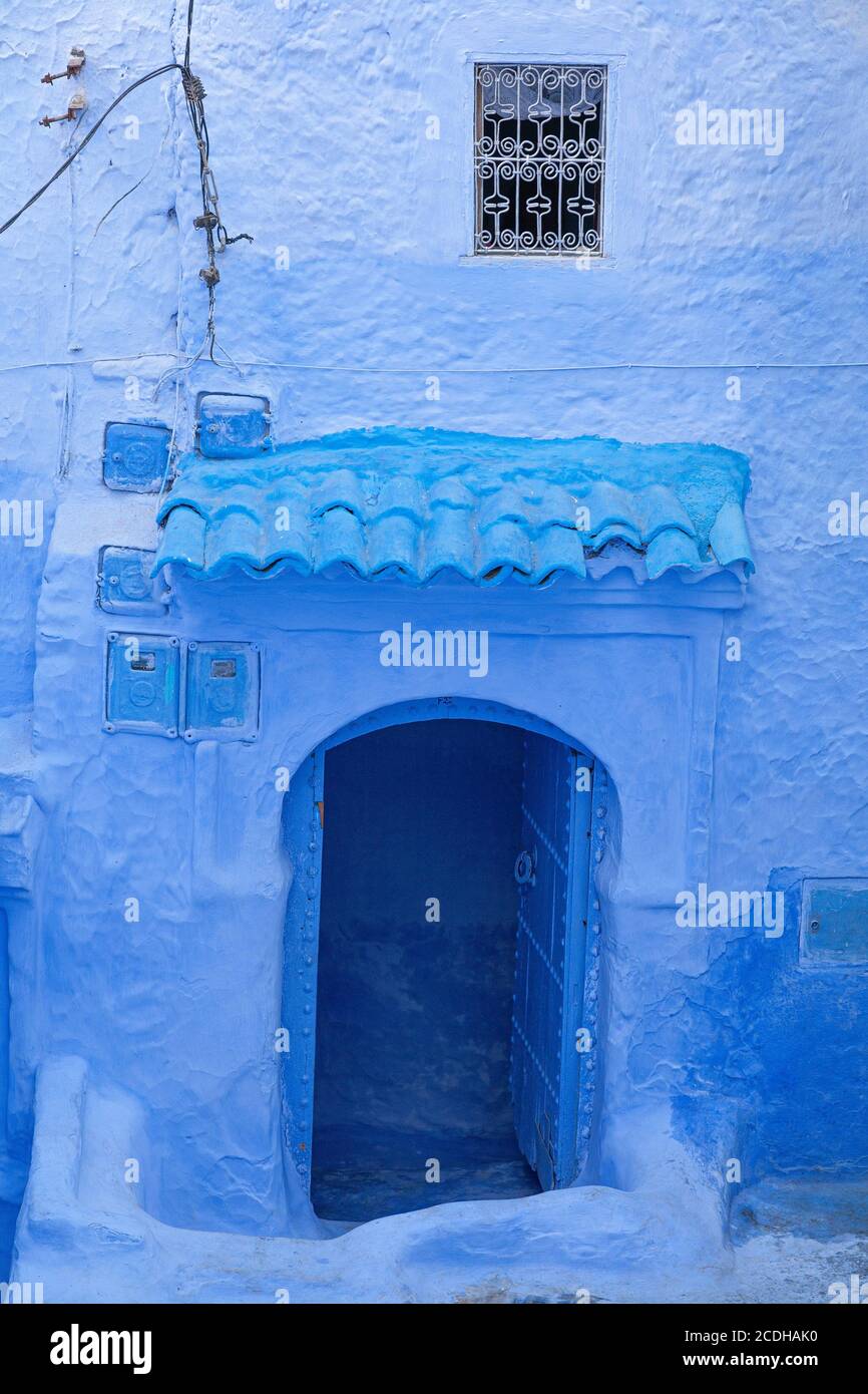 An open doorway in the blue coloured town of Chefchaouen, Morocco Stock Photo