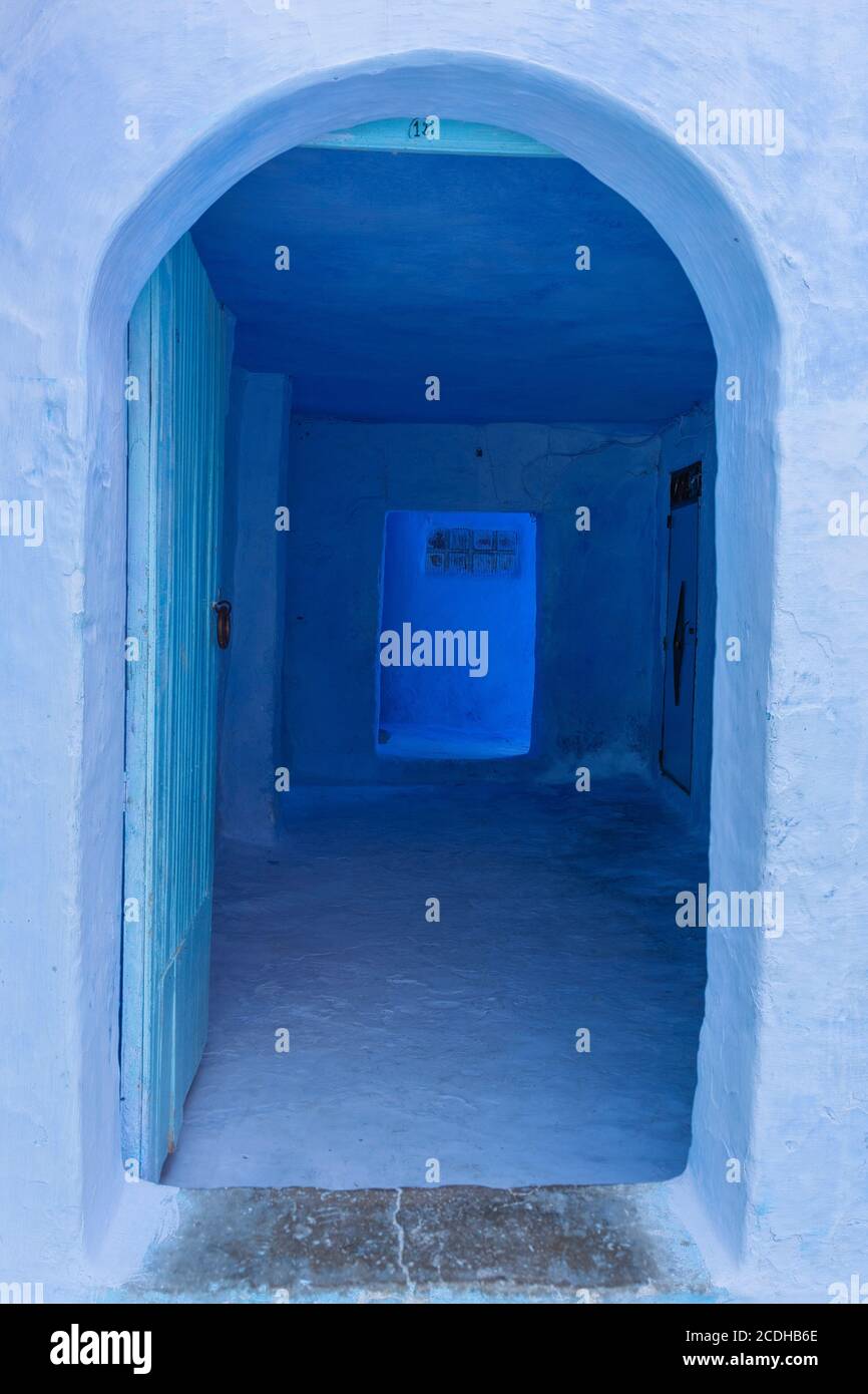 An open doorway in the blue coloured town of Chefchaouen, Morocco Stock Photo