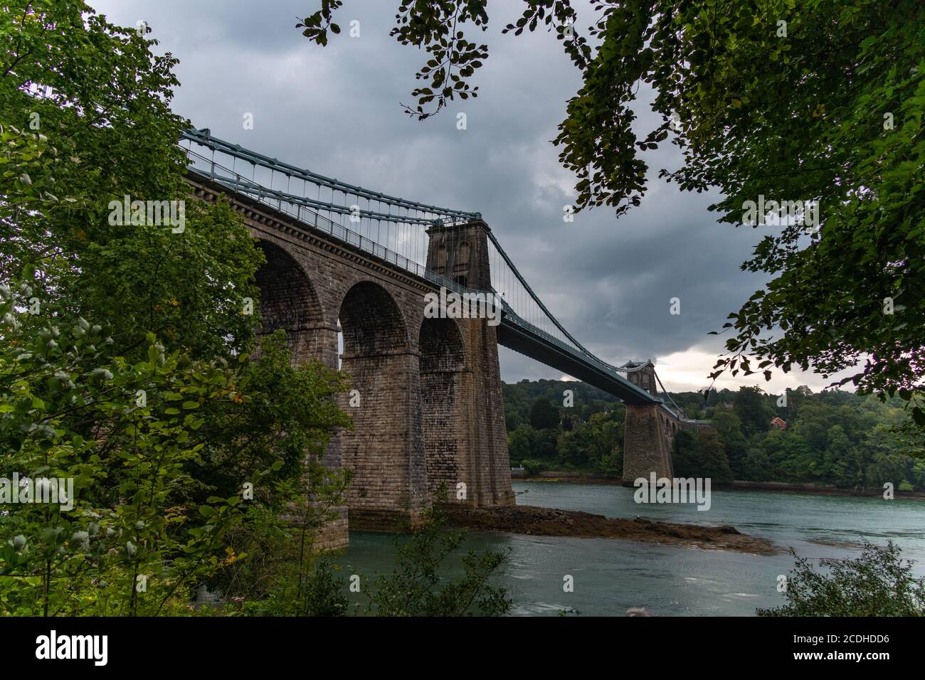 A view of Thomas Telford's suspension bridge that joins the island of Anglesey to mainland Wales. Stock Photo