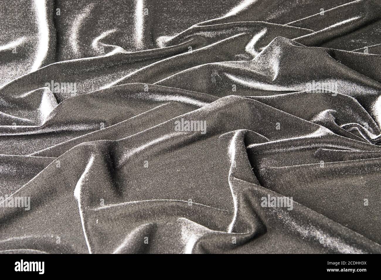 grey glossy velvet is formative folds and light-sh Stock Photo