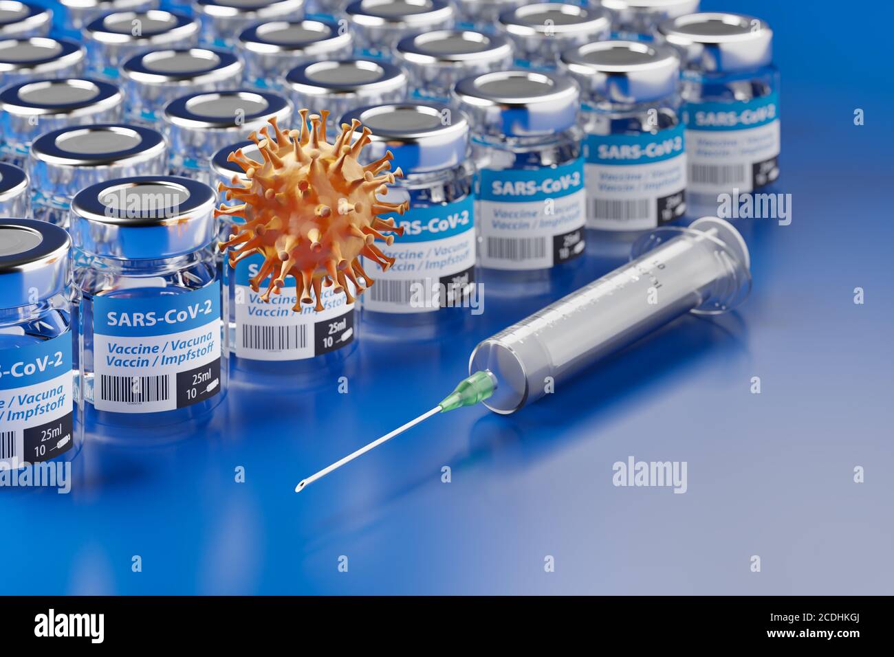 Vaccination against the Corona Virus SARS-CoV-2: glass containers with vaccination, a syringe and a SARS-CoV-2 virus model in front. The word vaccinat Stock Photo