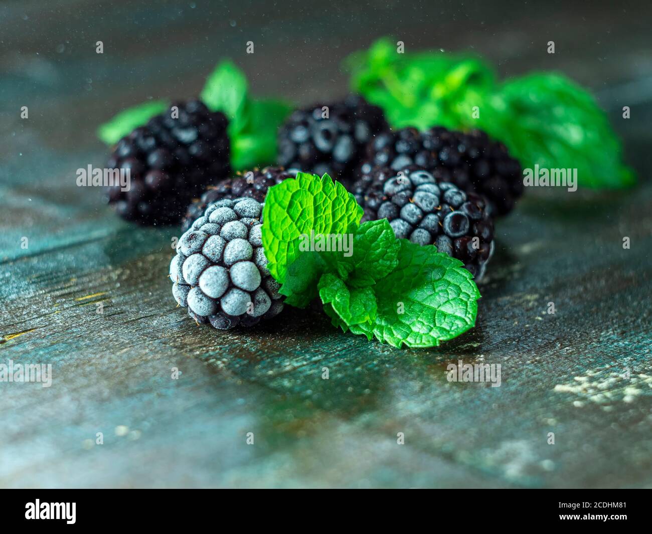 Frozen blackberry and blueberry berries, closeup. Selective focus, copy space. Stock Photo