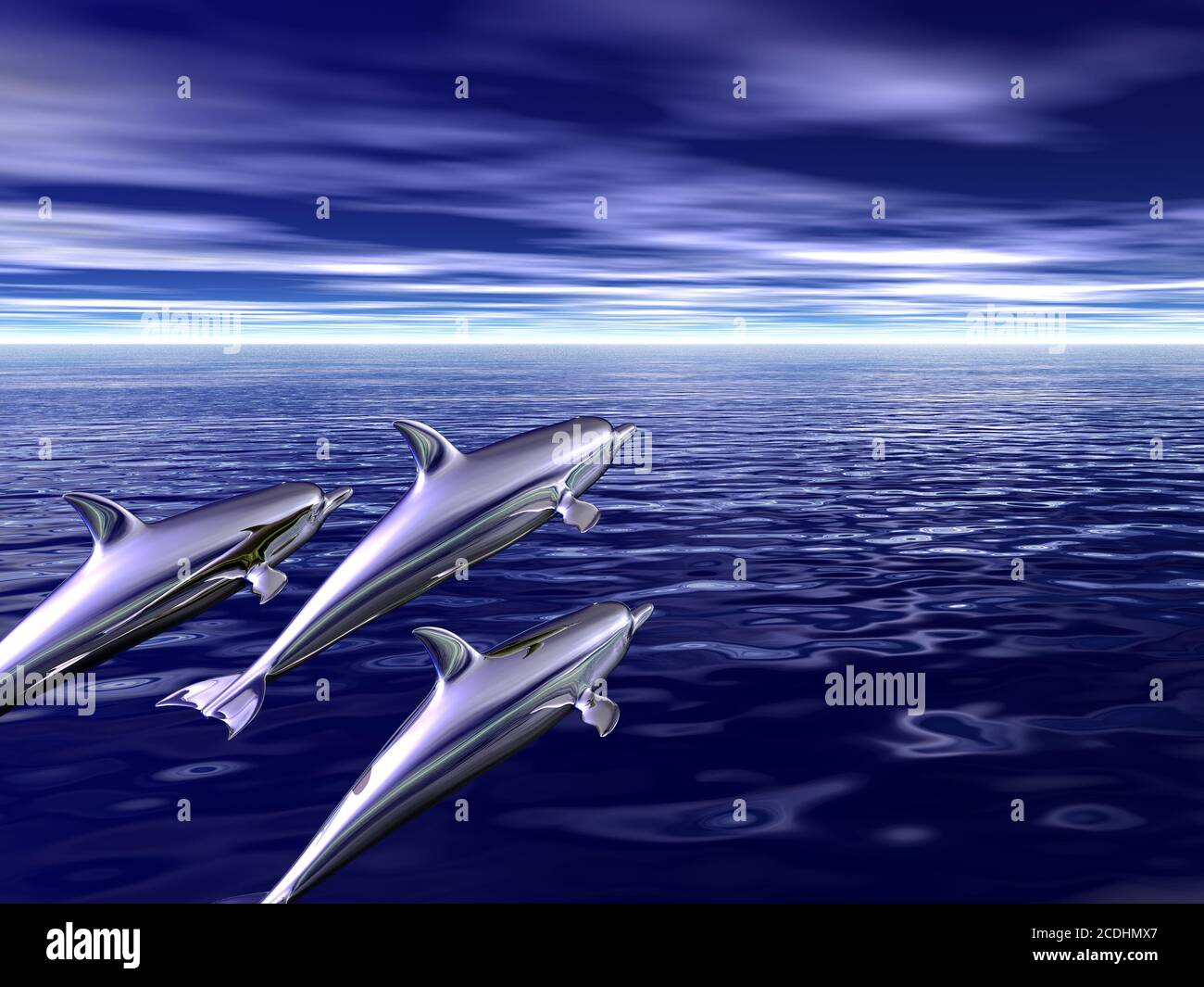 family of dolphins travels on ocean spaces Stock Photo