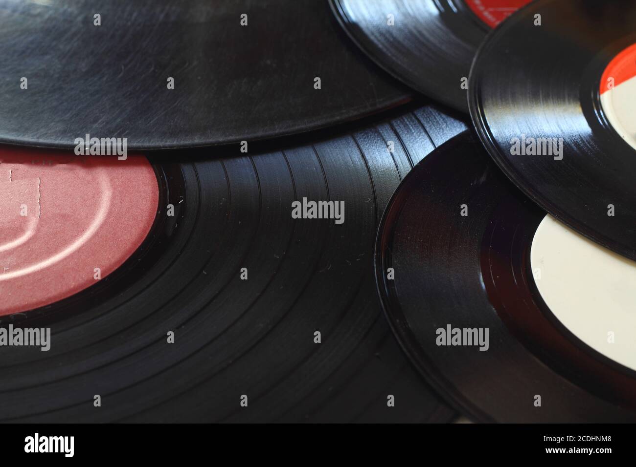 Background of vinyl records with red and white labels Stock Photo - Alamy