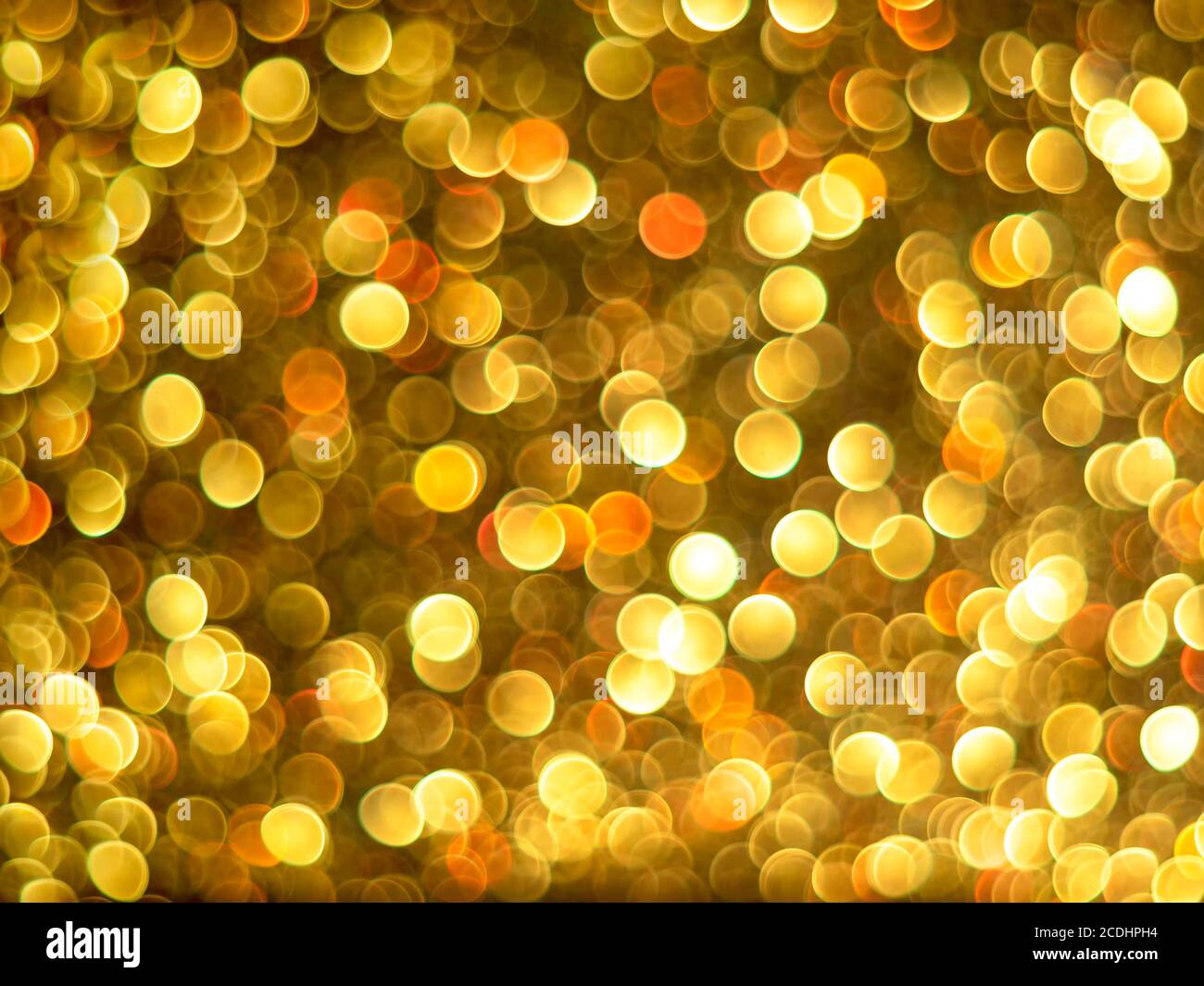 Gold bokeh holiday textured glitter background. Blurred abstract holiday background. Stock Photo