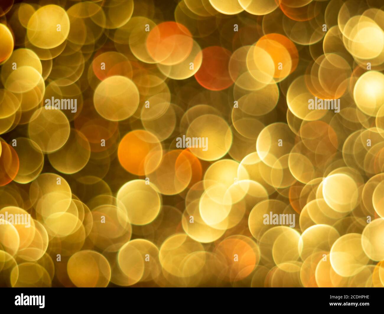 Gold bokeh holiday textured glitter background. Blurred abstract holiday background. Stock Photo