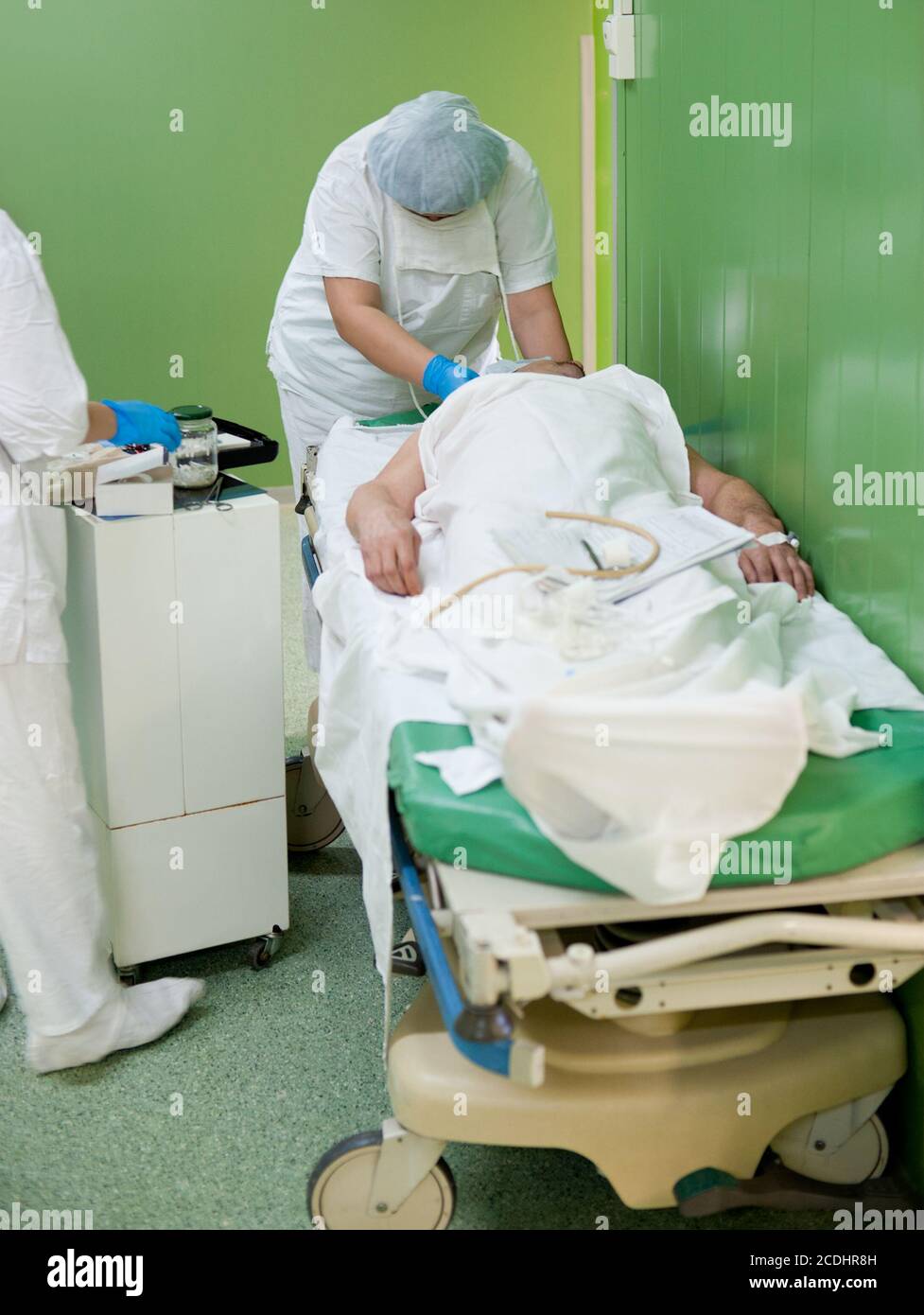nurse prepares patient for operation Stock Photo