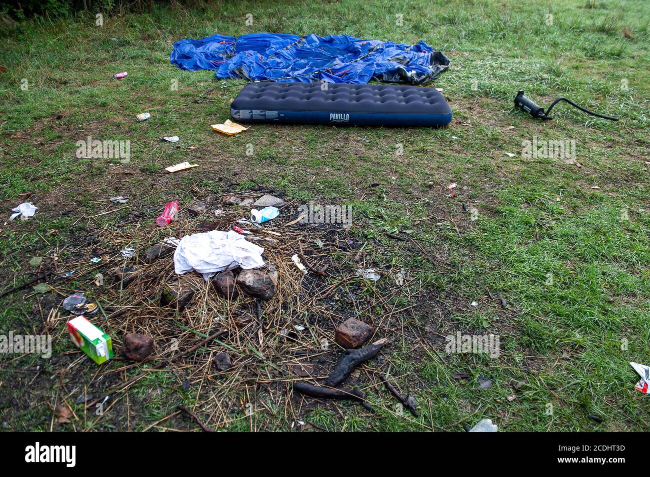 Eton, Windsor, Berkshire, UK. 28th August, 2020.  Anti social behaviour continues during the Coronavirus lockdown as more used tents and airbeds have been dumped in fields in Eton as youths continue to party whilst they are off school. This latest craze of leaving tents and rubbish behind in fields is being coined as 'fly camping'. Credit: Maureen McLean/Alamy Live News Stock Photo
