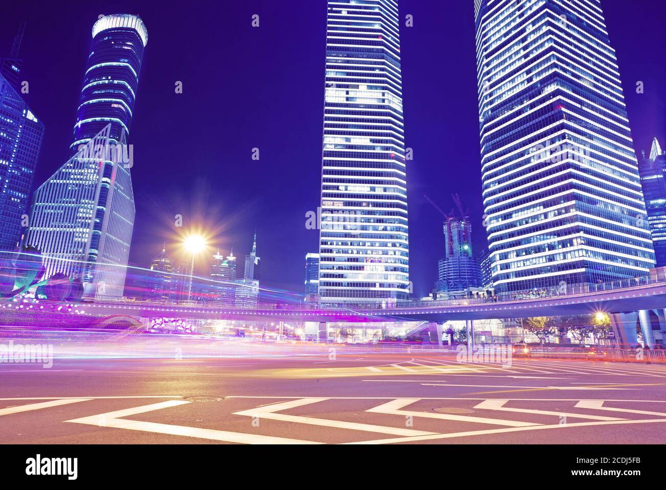 the light trails on the modern building background Stock Photo - Alamy