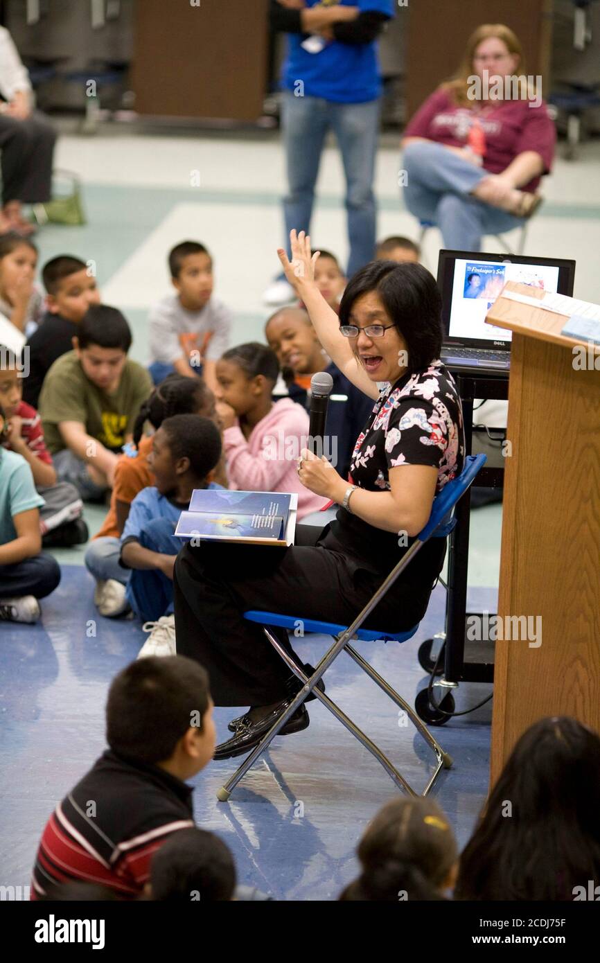 Austin, TX November 2, 2007: Korean-American children's author Linda Sue Park interacts with children at a north Austin elementary school as part of the Texas Book Festival's  authors-in-schools program. ©Bob Daemmrich Stock Photo