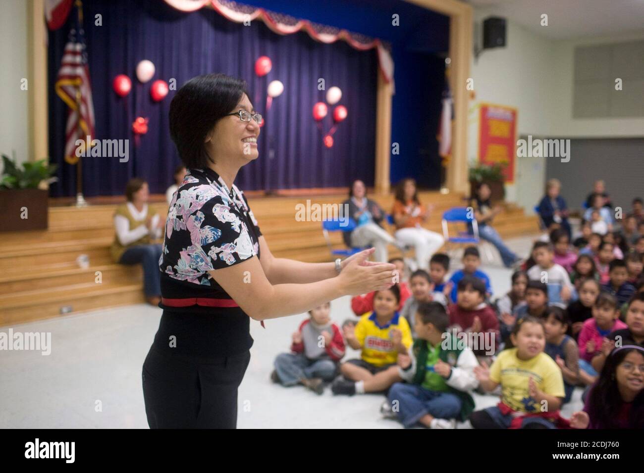 Austin, TX November 2, 2007: Korean-American children's author Linda Sue Park interacts with children at a north Austin elementary school as part of the Texas Book Festival's  authors-in-schools program. ©Bob Daemmrich Stock Photo