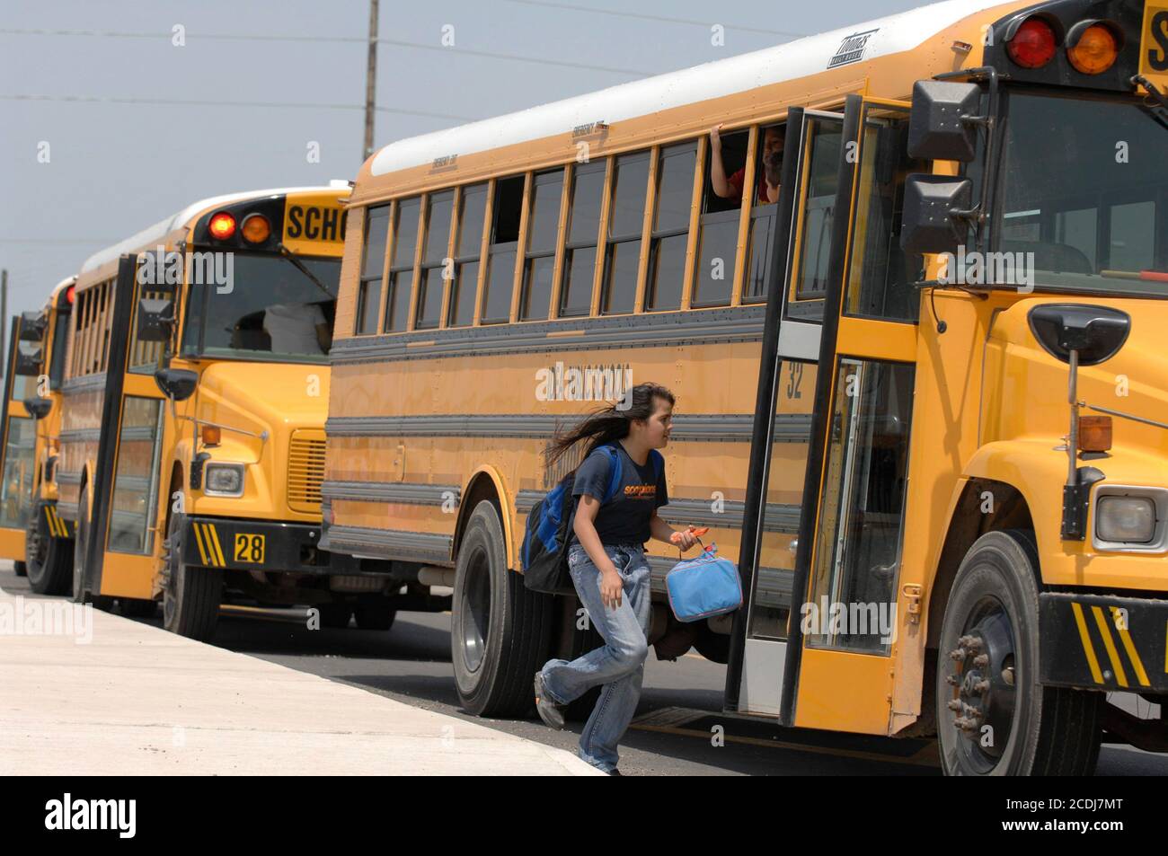 Brownsville, TX USA, April 13, 2007: Sixth and seventh grade students head to school buses at the end of the day at IDEA Public School, a charter public school serving the predominately Hispanic population in far south Texas. ©Bob Daemmrich Stock Photo