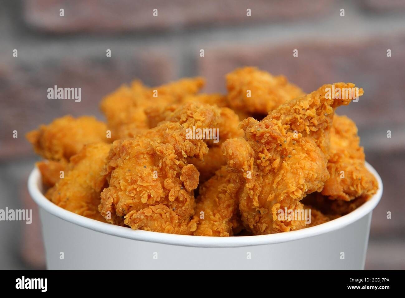 Chicken Bucket , with spicy sauce Stock Photo Alamy