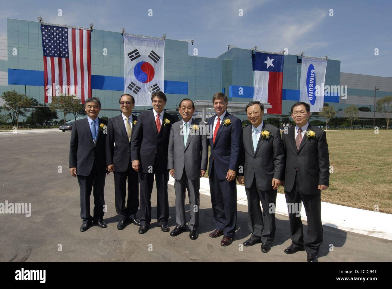 FILE Austin,TX June 14, 2007: Samsung CEO Jong-Yong Yun (c) is flanked by Texas Governor Rick Perry (l) and Mayor Will Wynn (r) at grand opening ceremonies at Samsung Austin Semiconductor (SAS) for 'Fab 2' manufacturing facility showcasing the Korean chip manufacturer's multi-billion-dollar U.S. investment. ©Bob Daemmrich Stock Photo