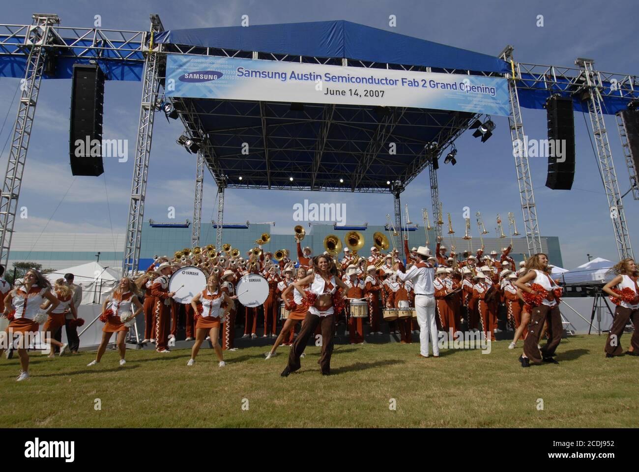 Austin,TX June 14, 2007: The University of Texas Longhorn band, cheerleaders and dancers perform at grand opening ceremonies at Samsung Austin Semiconductor (SAS) for 'Fab 2' manufacturing facility showcasing the Korean chip manufacturer's multi-billion-dollar U.S. investment. ©Bob Daemmrich Stock Photo