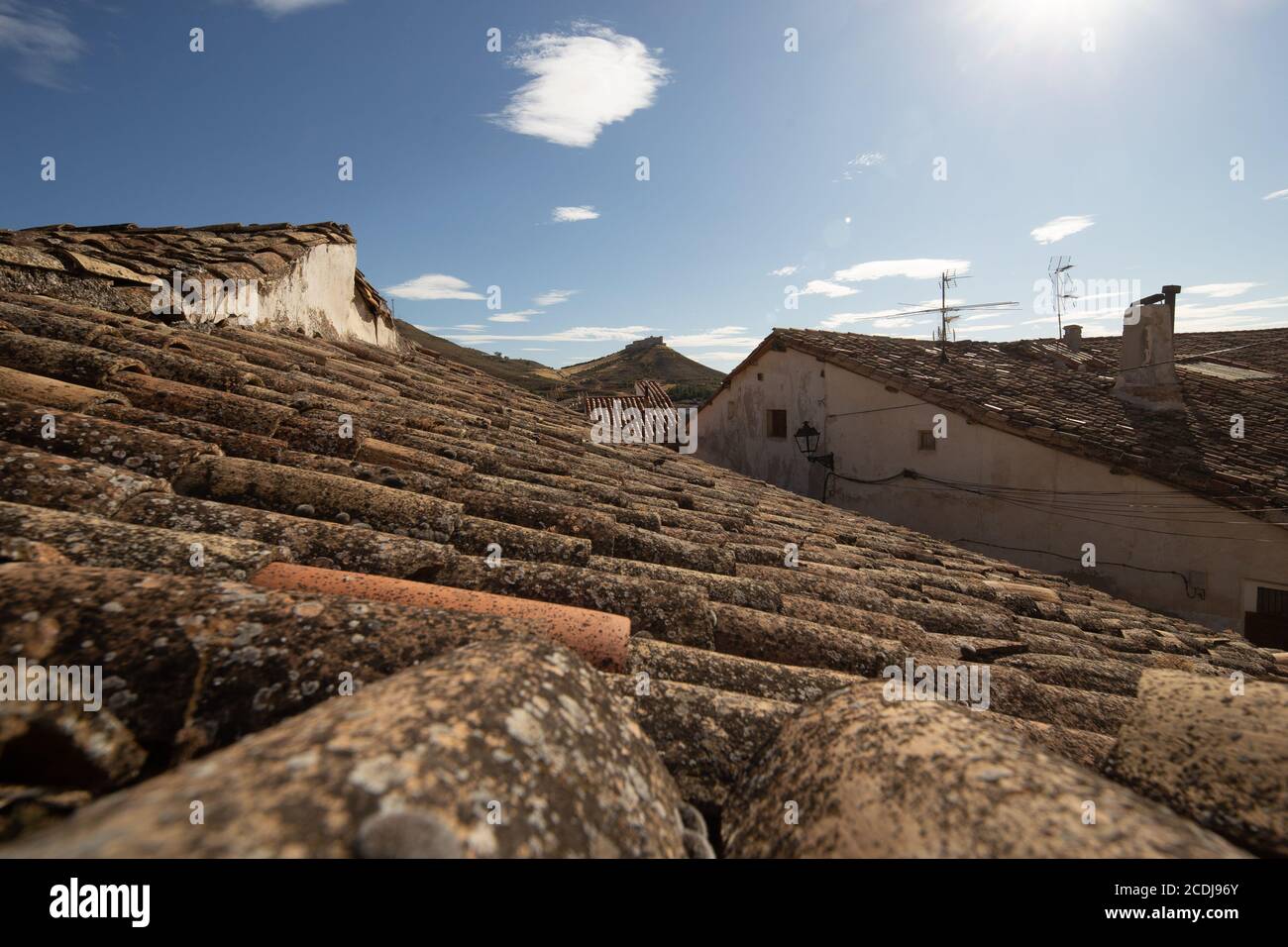 Arabic tile roofs and in the background the medieval castle of J Stock Photo