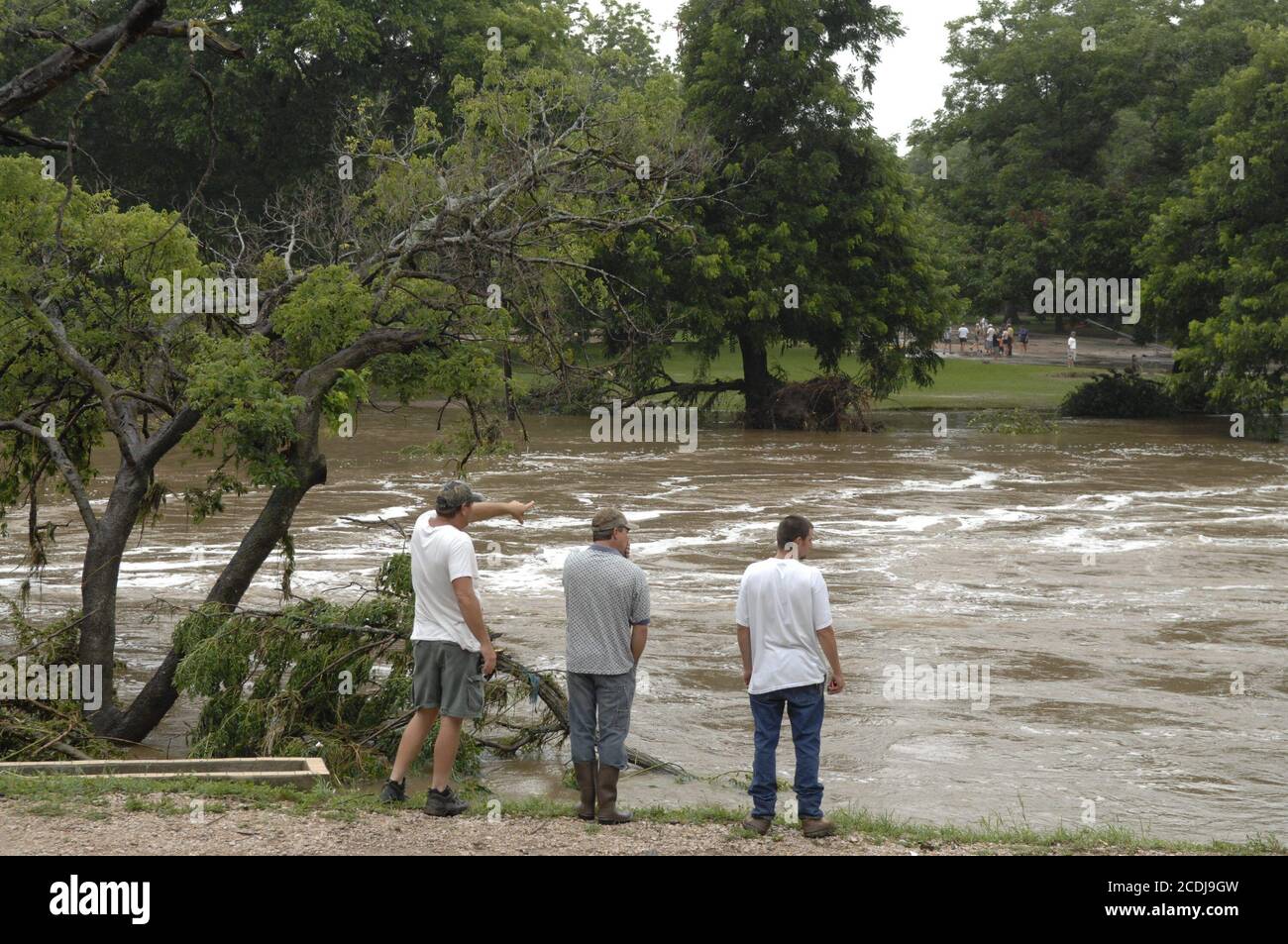 Marble Falls, TX  June 27, 2007:  Residents inspect normally placid Lake Marble Falls after up to 19 inches of rain in a few hours fell on the  area overnight. Flash flooding caused property damage in the millions as creeks overflowed an industrial area. No deaths were reported.        ©Bob Daemmrich Stock Photo