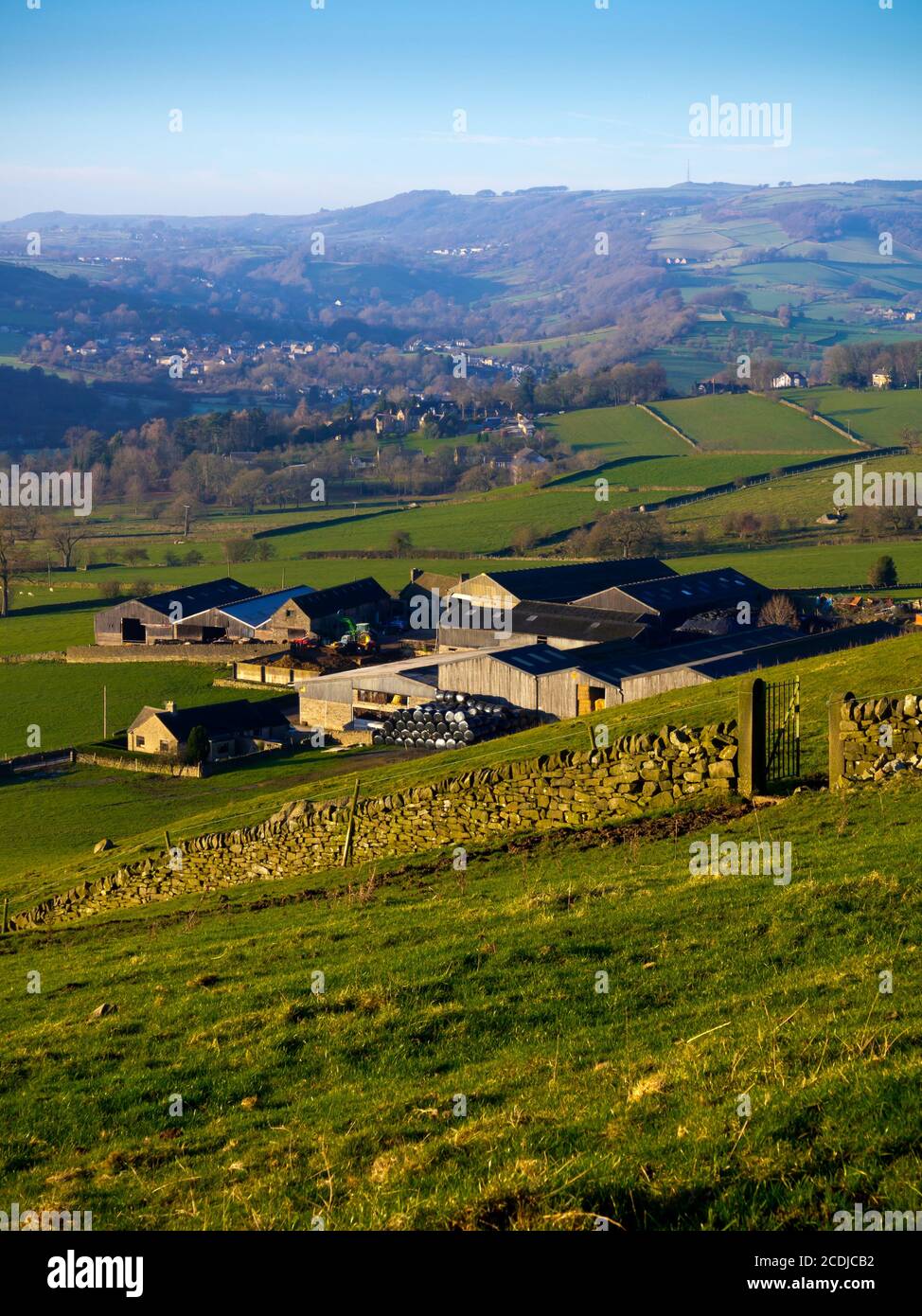 Farm buildings in landscape near Baslow in the Derbyshire Peak District ...