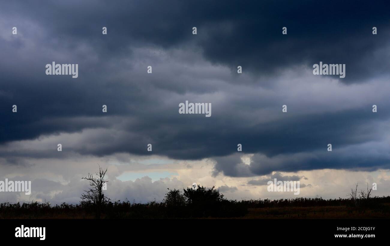 Sutton Heath, Woodbridge, UK - August 2020: Thunderous sky during a storm. Stock Photo