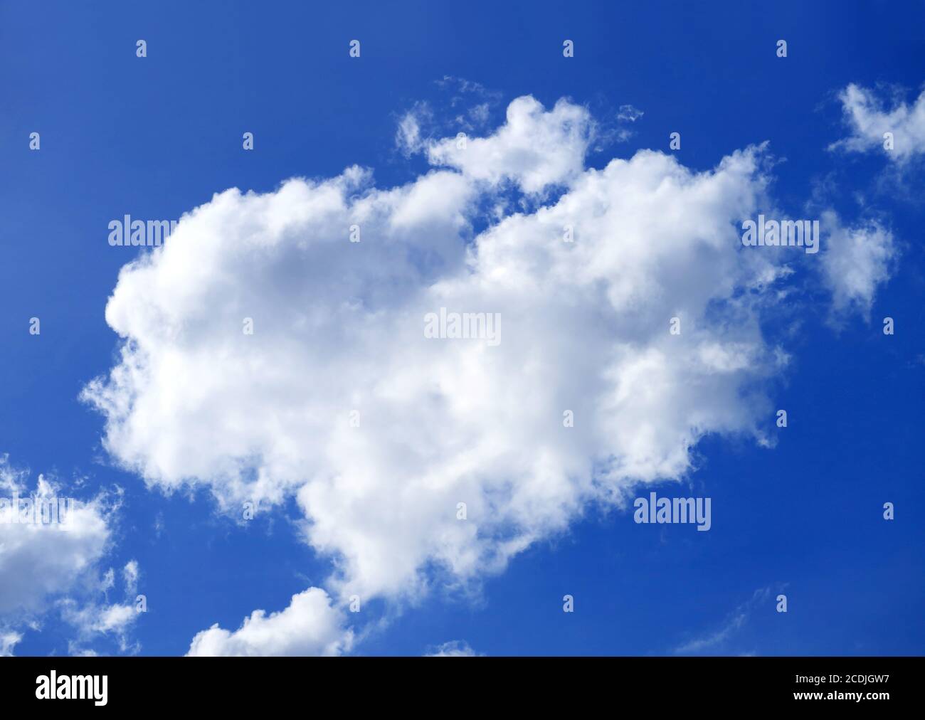 Fluffy cumulus clouds floating on the sunny blue sky Stock Photo - Alamy