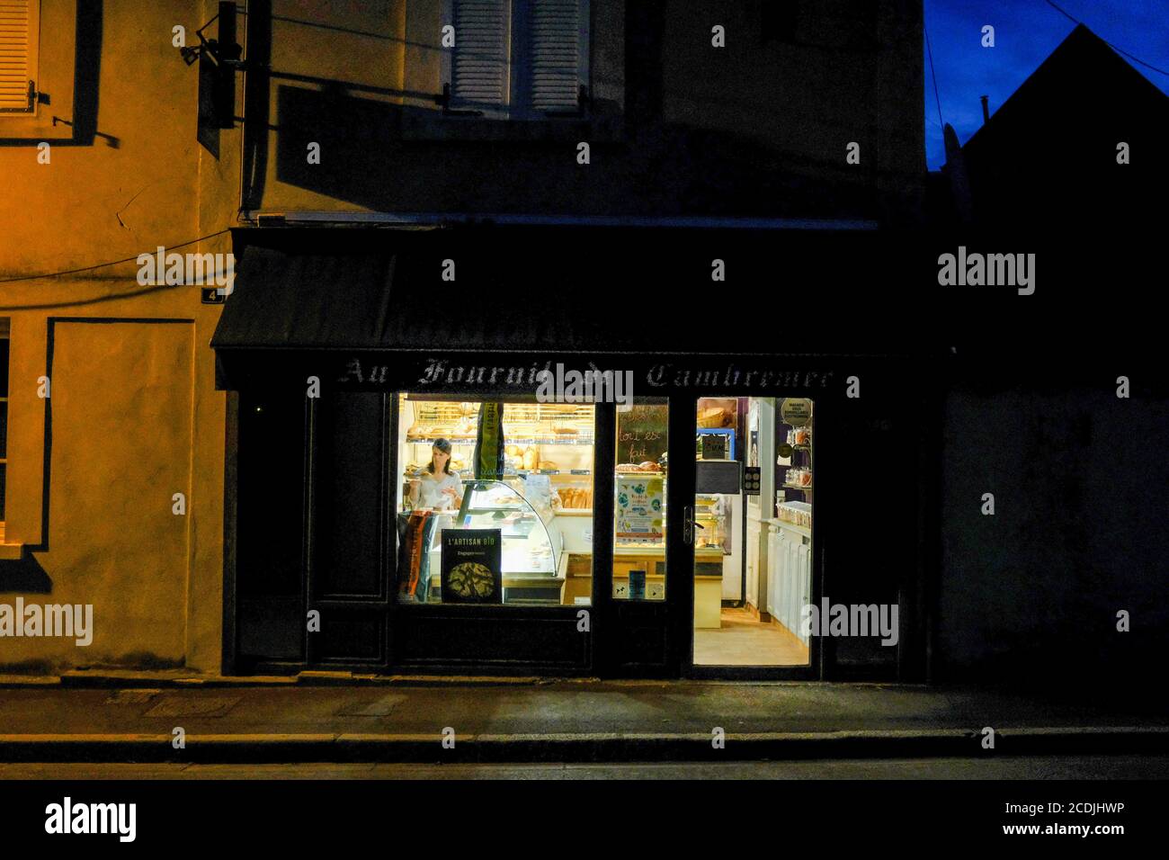 Bakery opens, early morning, in Cambremer, France, Normandy, Cider