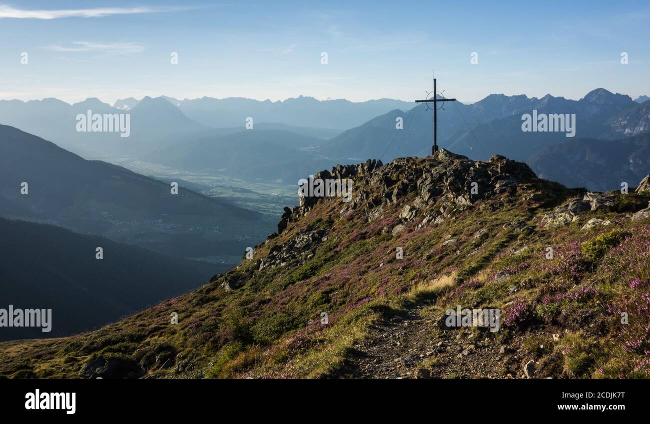 Cross on a mountain peak in Tyrol Austria Stock Photo