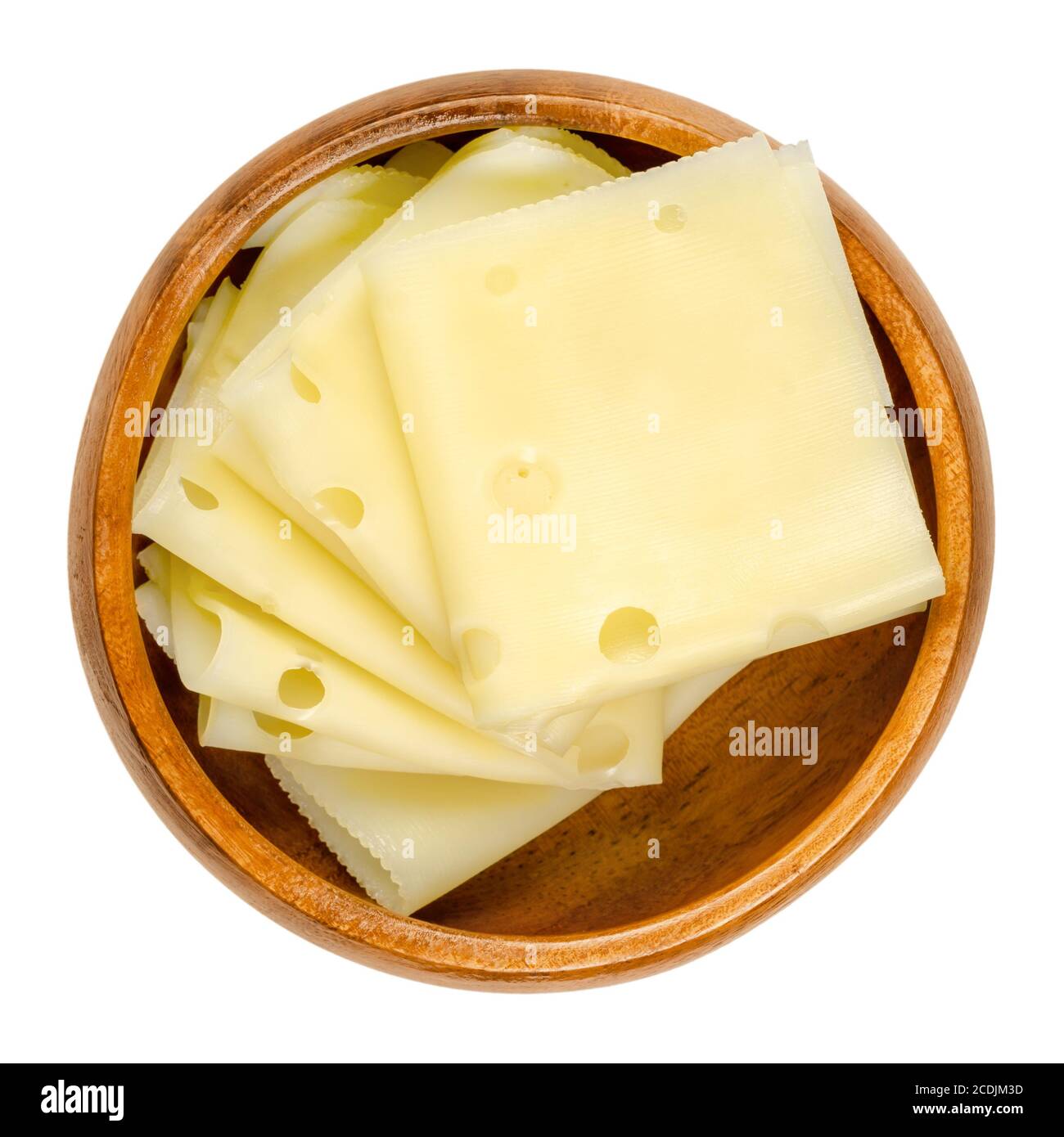 Emmental cheese slices in a wooden bowl. Folded slices of Emmenthal or Emmentaler. Yellow Swiss cheese with holes, medium-hard, with savory mild taste. Stock Photo