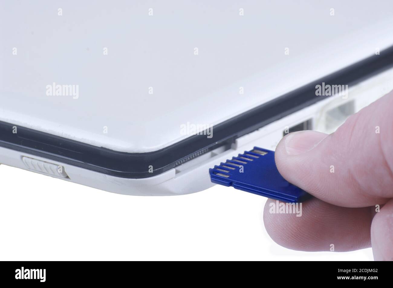 Plugging removable flash disk memory into laptop  slot Stock Photo