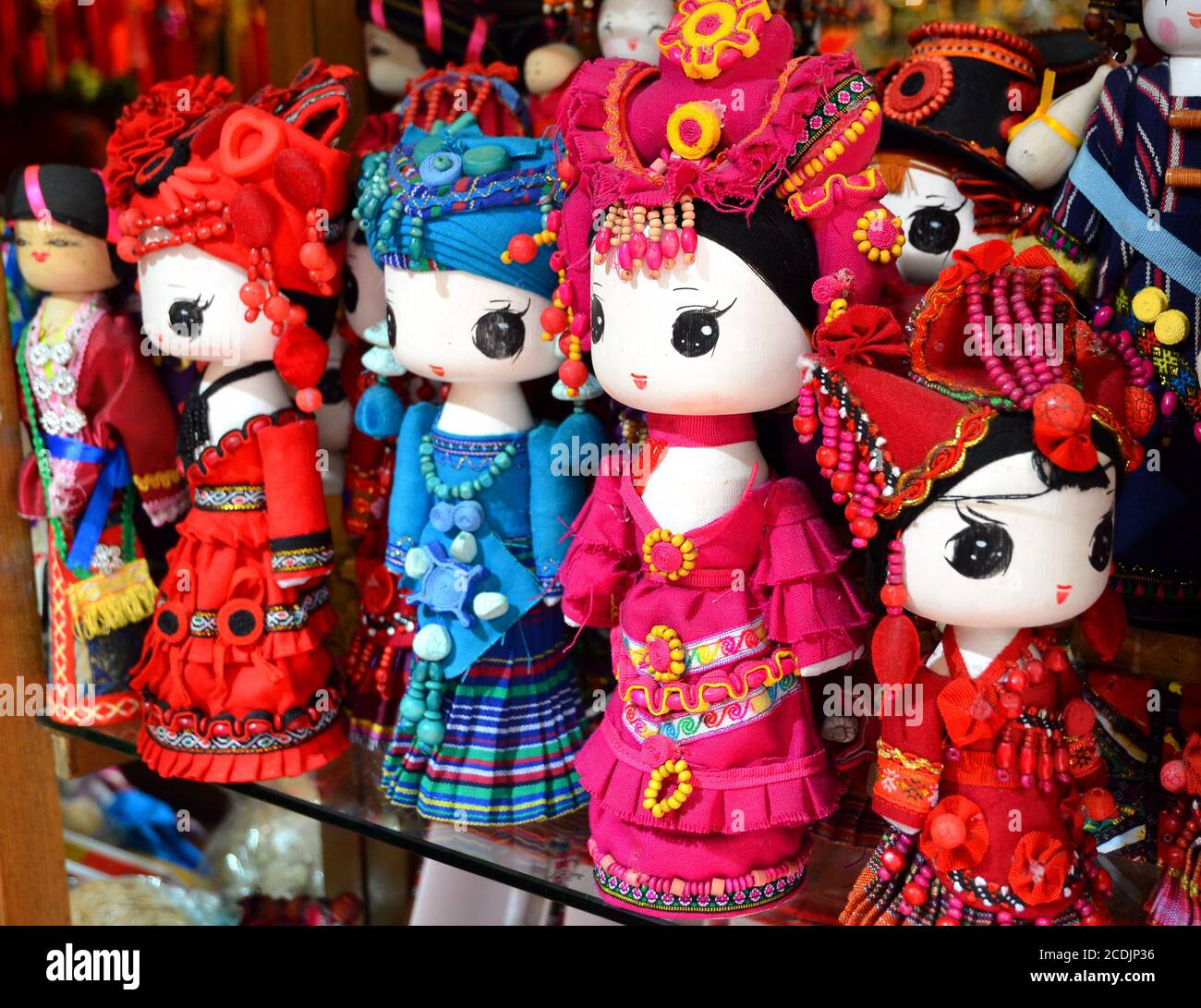 SHANGHAI, CHINA - May 7, 2017 - Handmade dolls are sold as souvenirs from China in national clothes Stock Photo