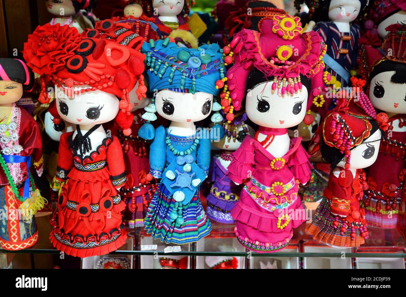 SHANGHAI, CHINA - May 7, 2017 - Handmade dolls are sold as souvenirs from China in national clothes Stock Photo